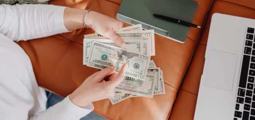 woman counting dollar bills